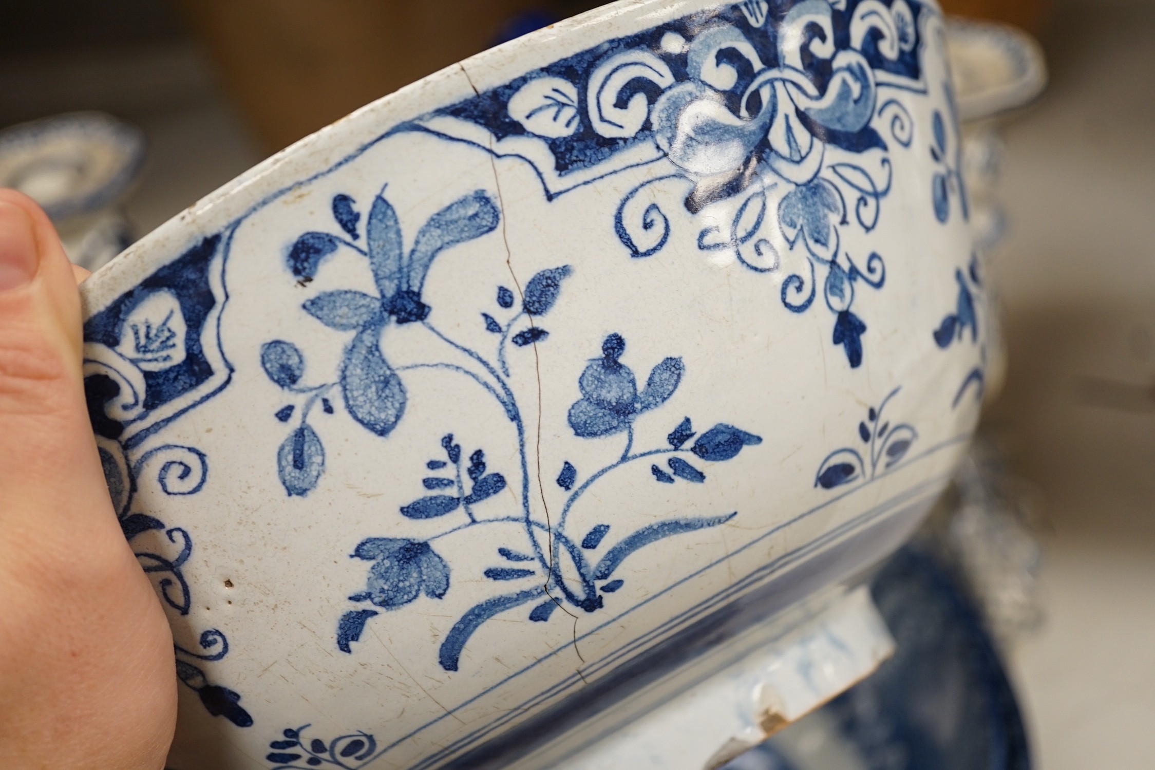 A pair of Delft blue and white candlesticks together with an 18th century Delft bowl, a Moroccan pottery jar with cover, and two pearlware bowls